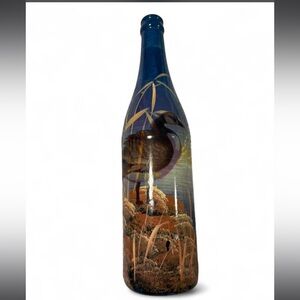 decorative hand-painted glass bottle featuring a goose in a marsh scene